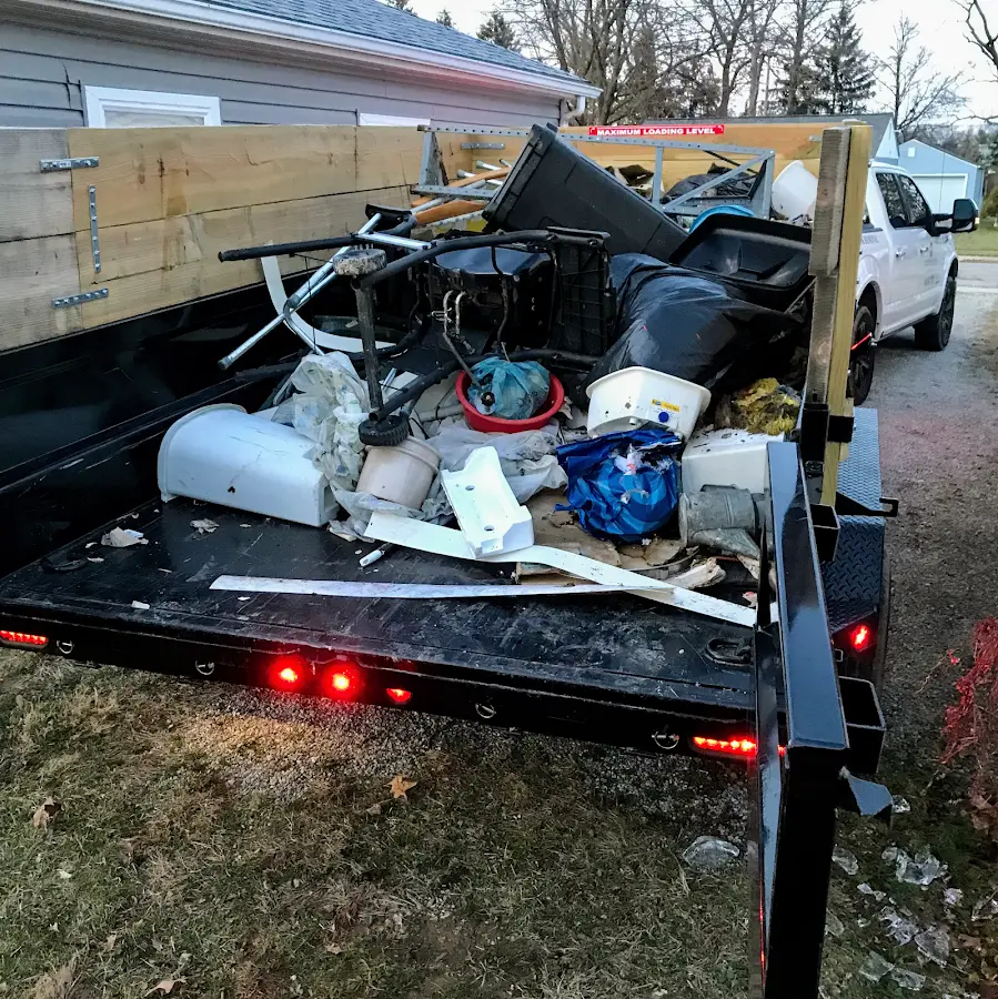 Roll-off dumpster delivered to a residential driveway in Miami Lakes