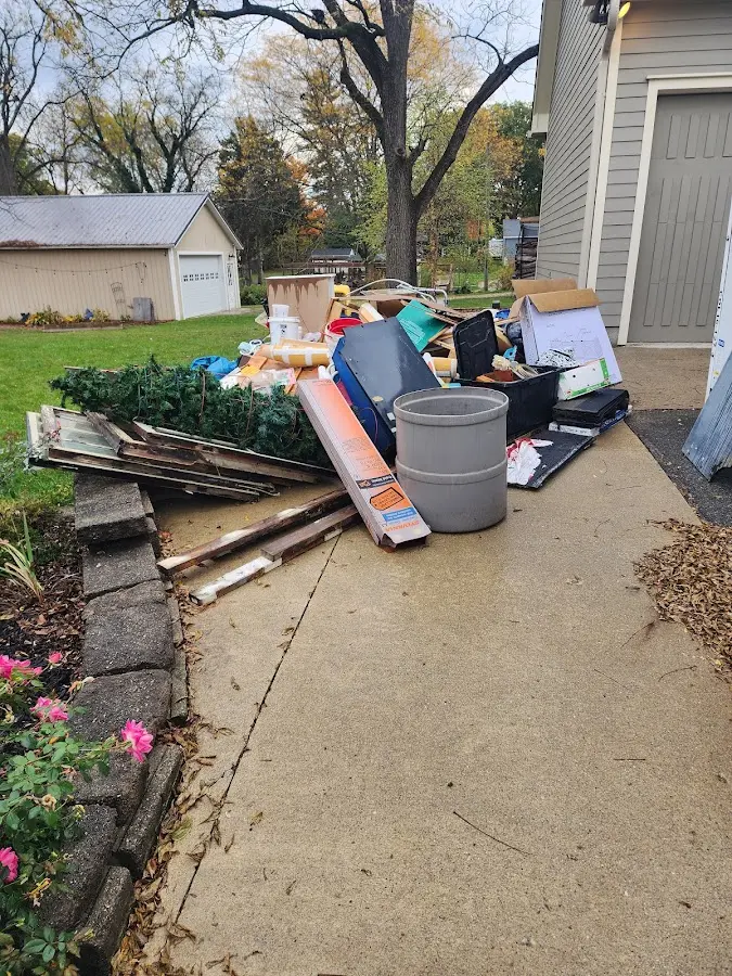 Dumpster being loaded with debris for Residential Dumpster Rental in Miami Lakes